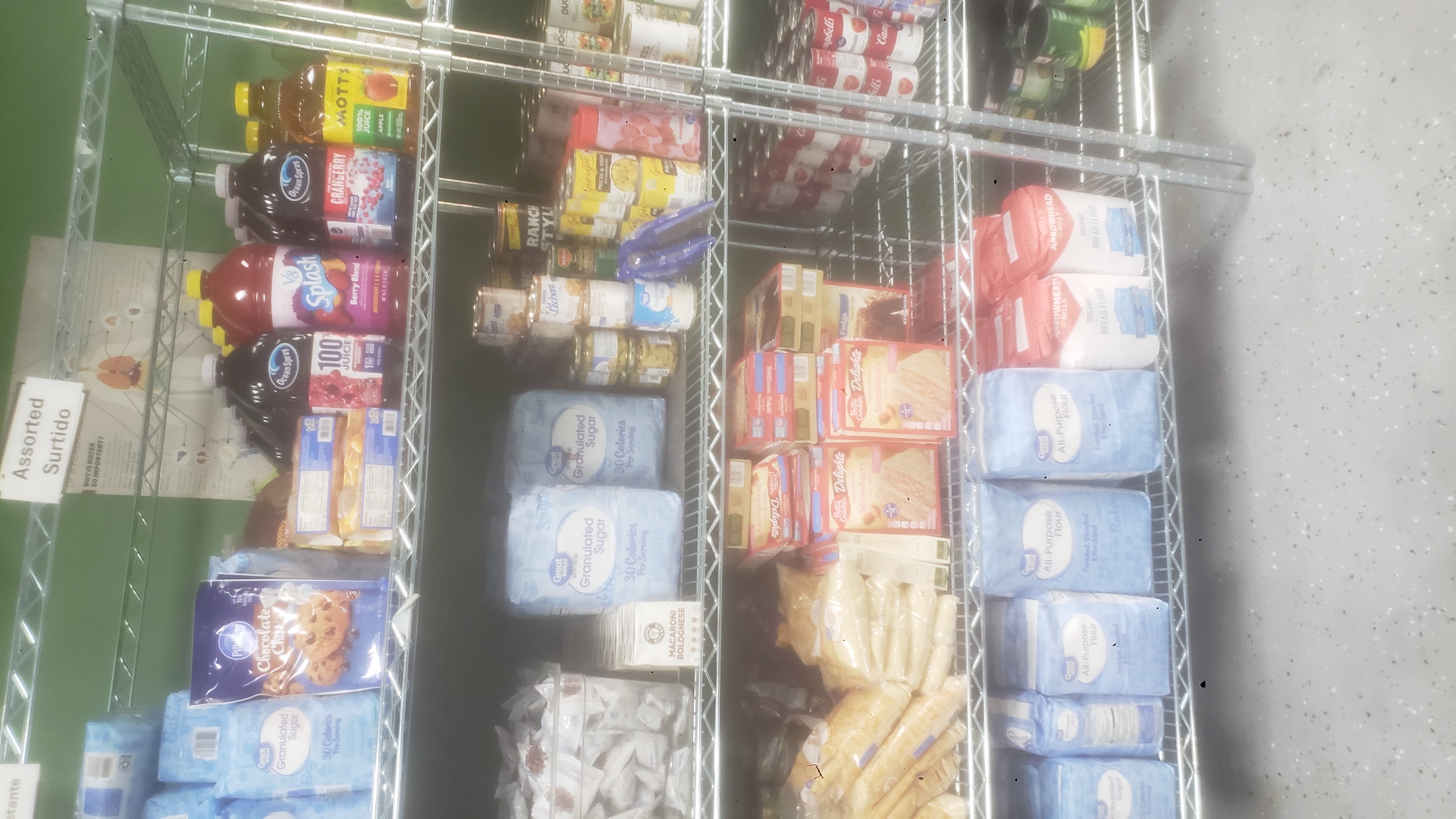 Food and drinks on a shelf.
